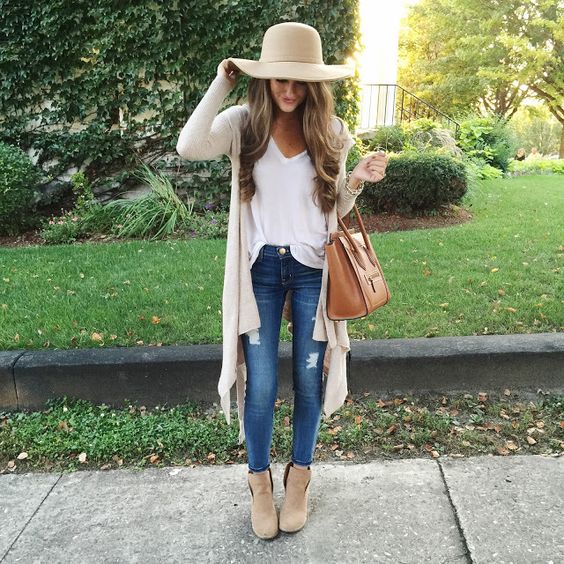 blue jeans, a white blouse, a long nude cardigan and nude ankle booties