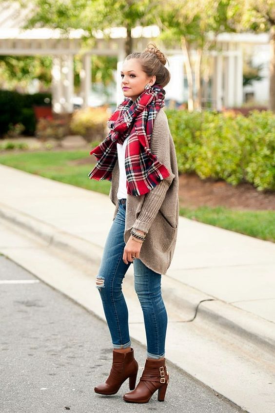 blue jeans, a white tee, an oversized brown cardigan and brown booties
