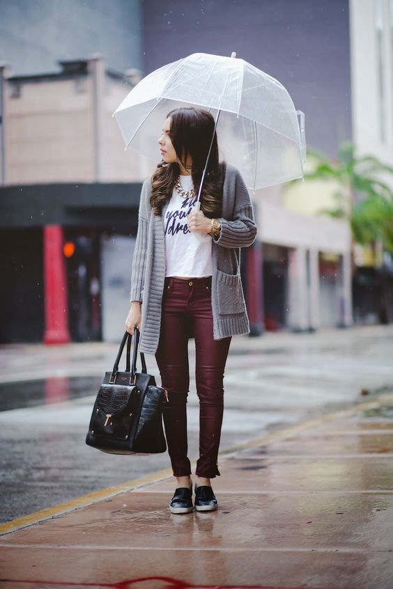 burgundy trousers, a printed tee, a grey cardigan and black slip-ons