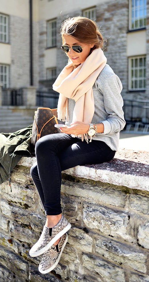 cream scarf, a grey knit, black jeans and animal printed loafers