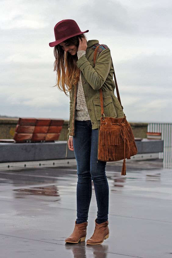 dark skinnies, a beige sweater, an olive green jacket and ankle boots