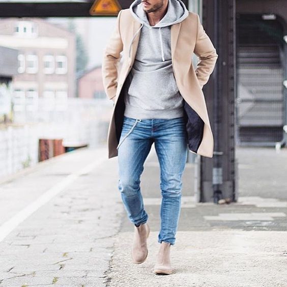blue jeans, nude boots, a camel coat and a grey sweatshirt