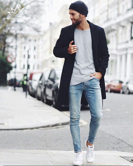blue skinnies, a grey t-shirt, a black coat and white sneakers