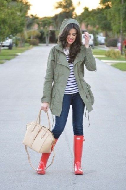 jeans, a striped tee, an olive green jacket and red rain boots