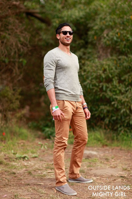 a grey sweater, ocher pants and brown shoes