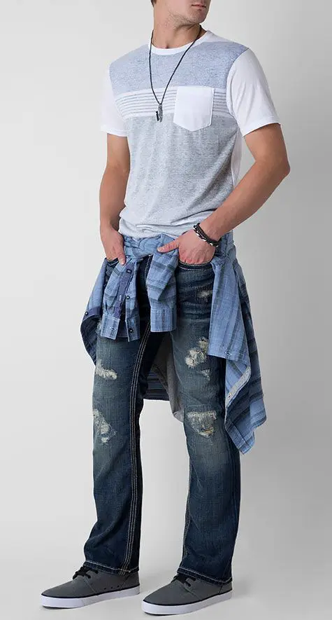 ripped blue jeans, a grey t-shirt, a plaid shirt and grey chucks