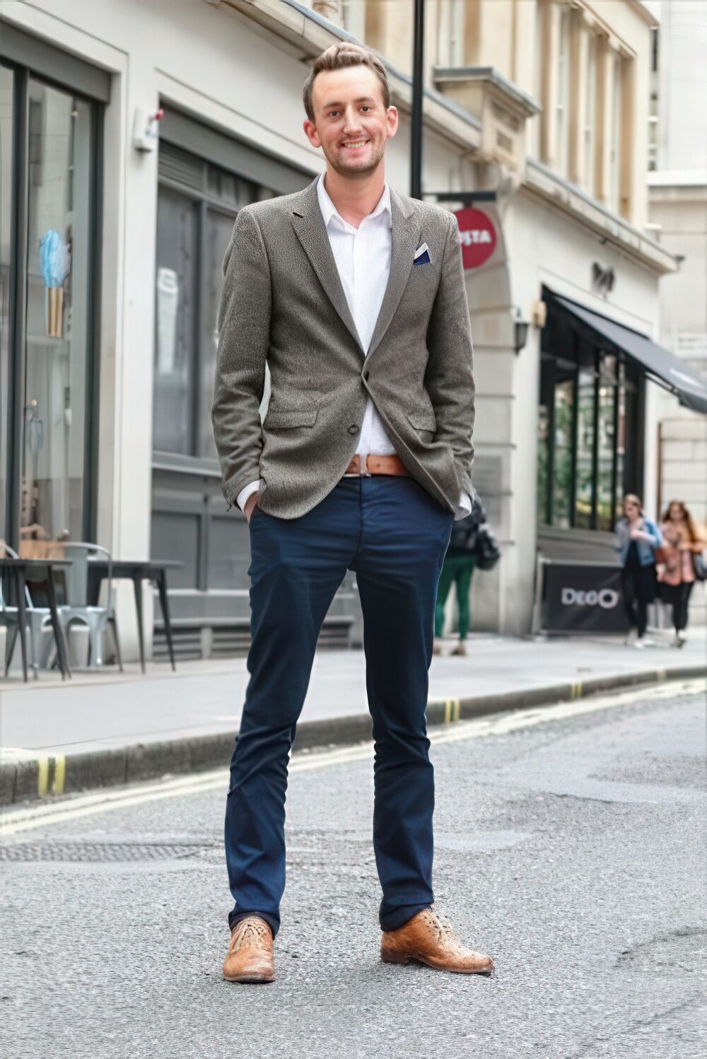 Navy pants, a white shirt, a grey blazer and ocher accents