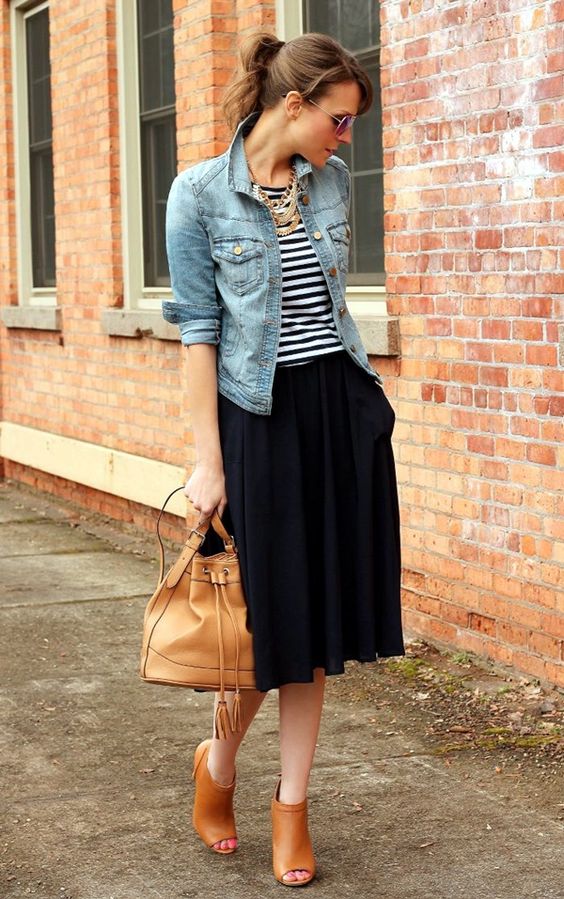 black skirt, a striped tee, brown cutout booties and a statement necklace