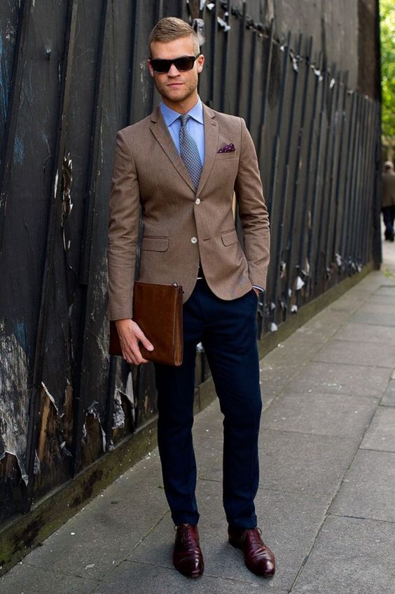 navy trousers, a brown blazer, a shirt and a tie, burgundy shoes