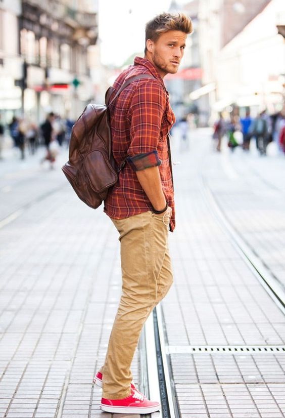 ocher pants, a plaid shirt and red Converse