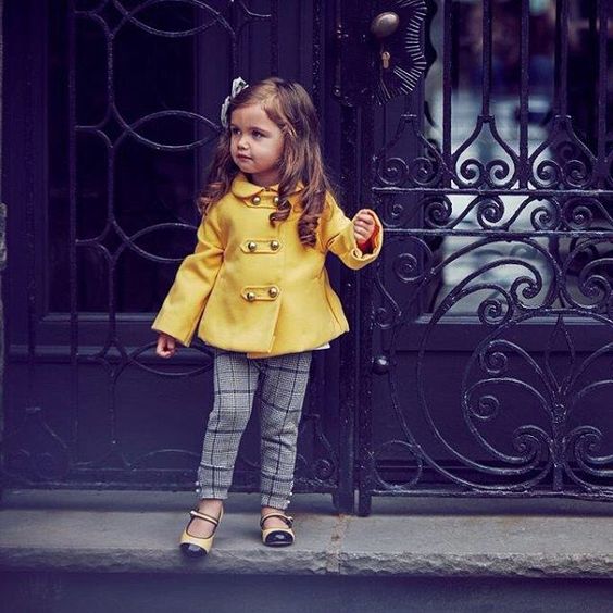 plaid grey trousers, a yellow coat, yellow and black shoes