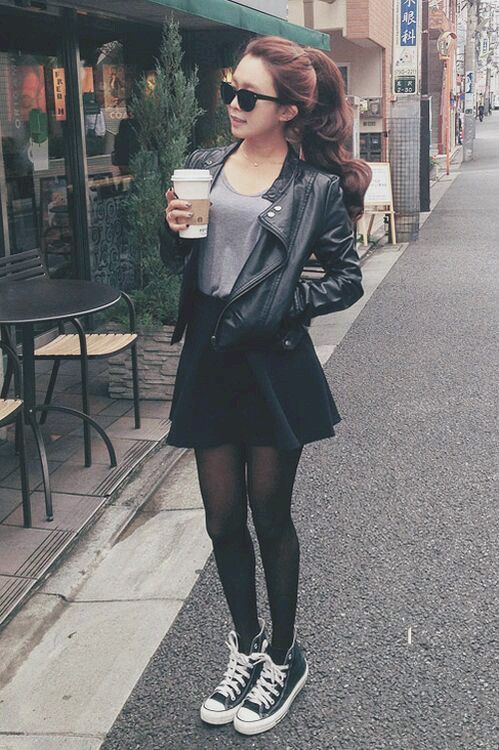 black skater skirt, a grey t-shirt, a black leather jacket and black Converse