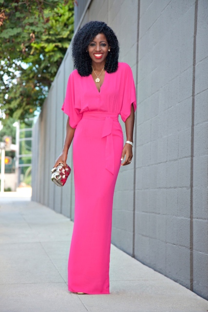 Eye-catching pink maxi dress with clutch
