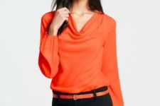 Orange blouse with orange belt and black trousers