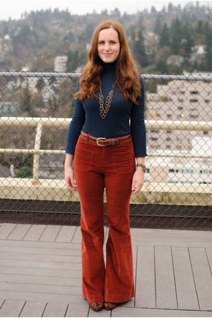Retro styled look with flared corduroy pants, dark blue turtleneck and printed boots