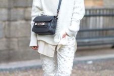 Stylish look with loose sweatshirt, unique pants and metallic platform shoes
