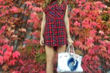 Super mini shirtdress with black flat boots and printed bag