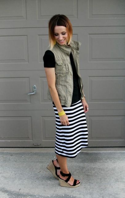 WIth black shirt and striped skirt