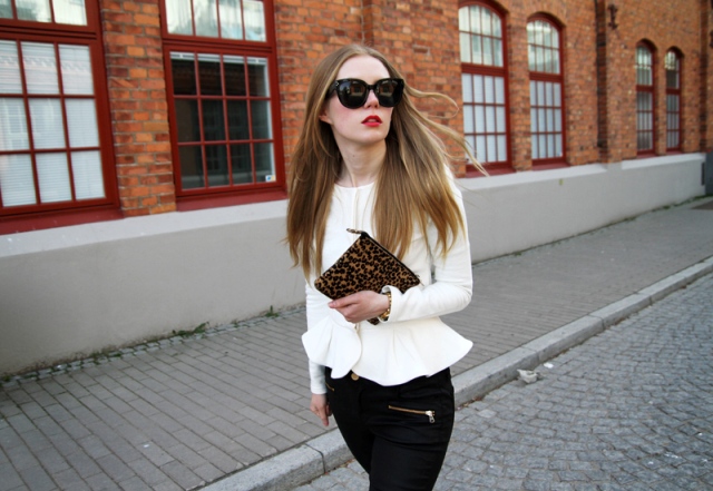 White jacket with black trousers and leopard clutch