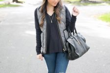 With black loose blouse, distressed jeans and gray boots