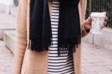 With black scarf, striped shirt and distressed jeans