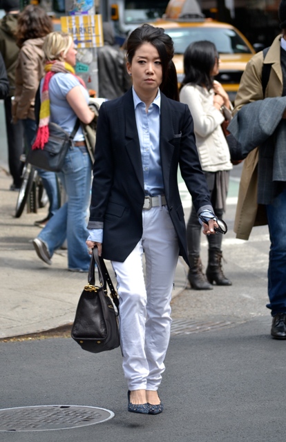 With blue shirt, white pants and pumps