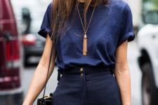 With dark blue t-shirt tassel necklace and bag