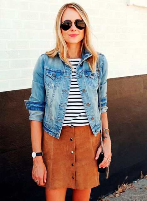 With denim jacket and suede skirt
