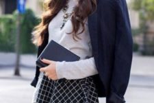 With gray shirt, printed skater skirt and statement necklace