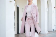 With light pink coat and black loafers