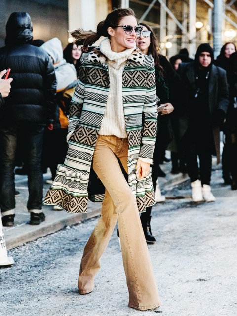 With oversized pullover, printed coat and sunglasses
