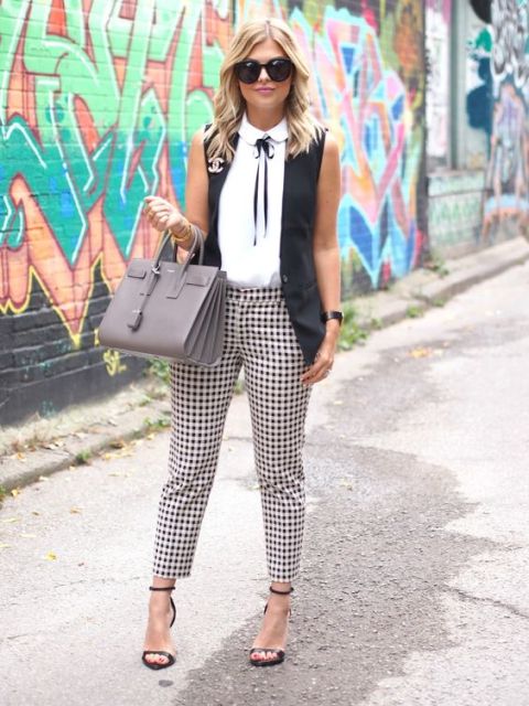 With patterned trousers, white shirt and heels