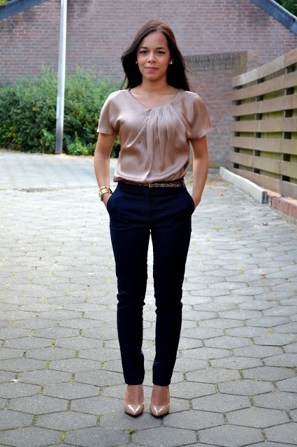 With silk pink blouse and neutral shoes