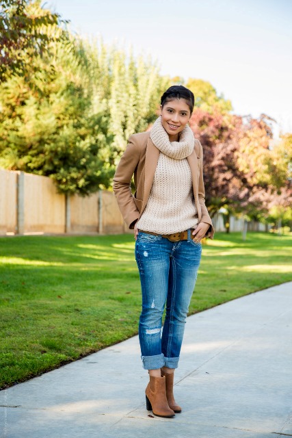 With sweater, camel jacket and cuffed jeans