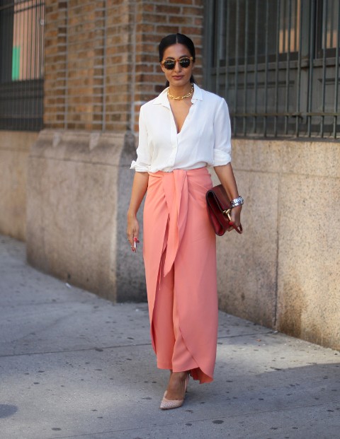 With white blouse, neutral pumps and red clutch