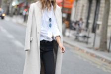 With white blouse, skinny trousers and long coat