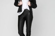 With white t-shirt, leather trousers and boots