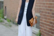 With white wide leg trousers and leather clutch