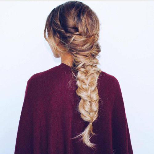 large messy back braid with a twist