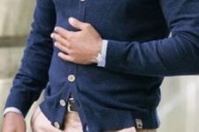 03 navy cardigan with white buttons paired with a blue gingham shirt and a striped tie