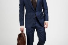 07 navy suit, brown shoes, a dark brown tie and a patterned shirt
