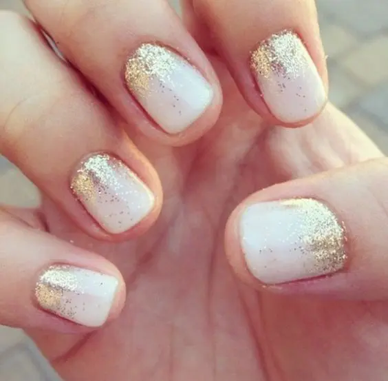 white nails with gold glitter