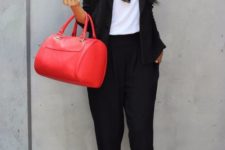10 black pant suit, a white top, heels and a red bag