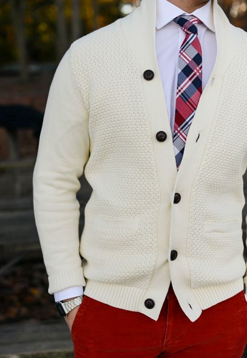 ivory cardigan, a white shirt and a checked tie