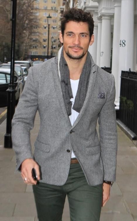 olive green pants, a white tee and a tweed jacket