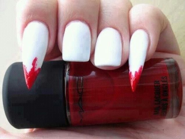 white nails with sharp bloody accents