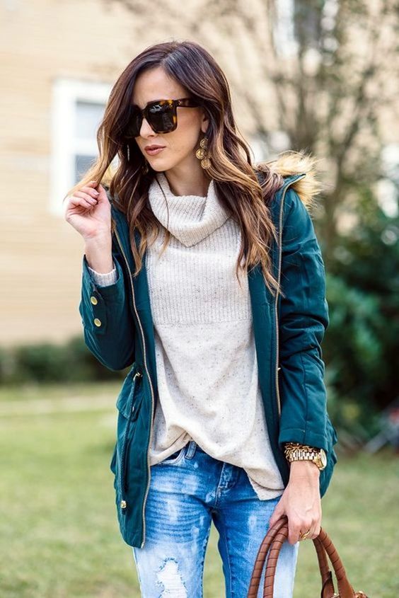 distressed denim, a neutral turtleneck and an emerald coat