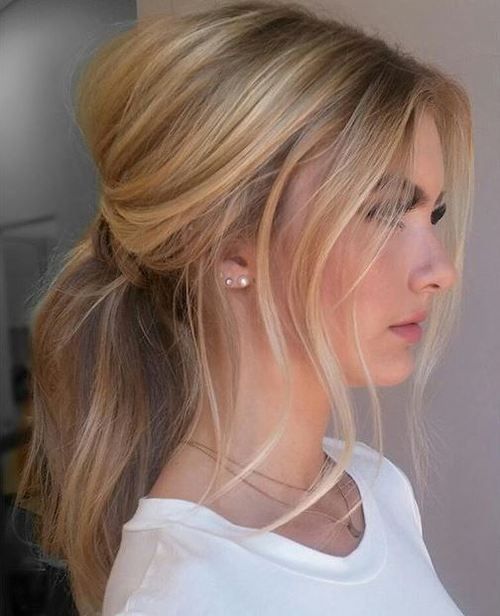sweep hair into a low ponytail and let pieces fall out on the sides