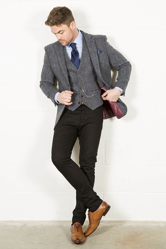 black pants and a classic tweed vest and jacket