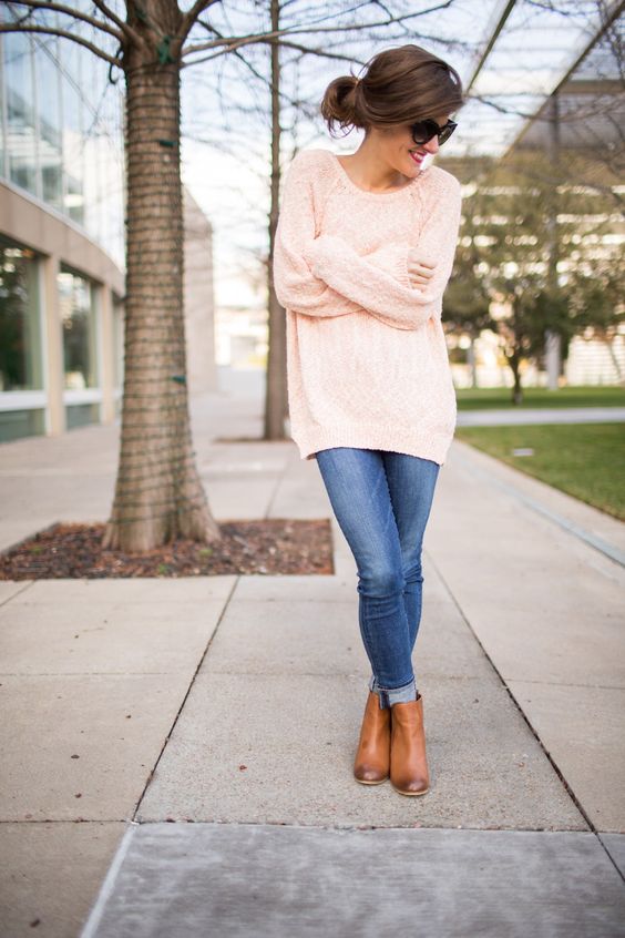 jeans, an oversized blush sweater and boots